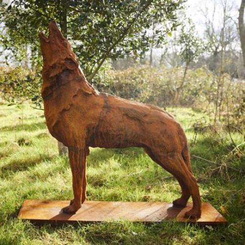 CAST IRON HOWLING WOLF ON PLINTH STATUE